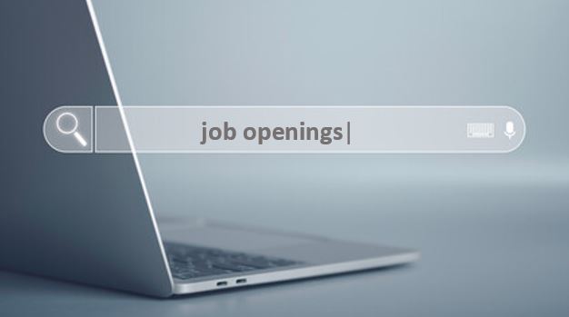 Open laptop with "job openings" in search window. 
